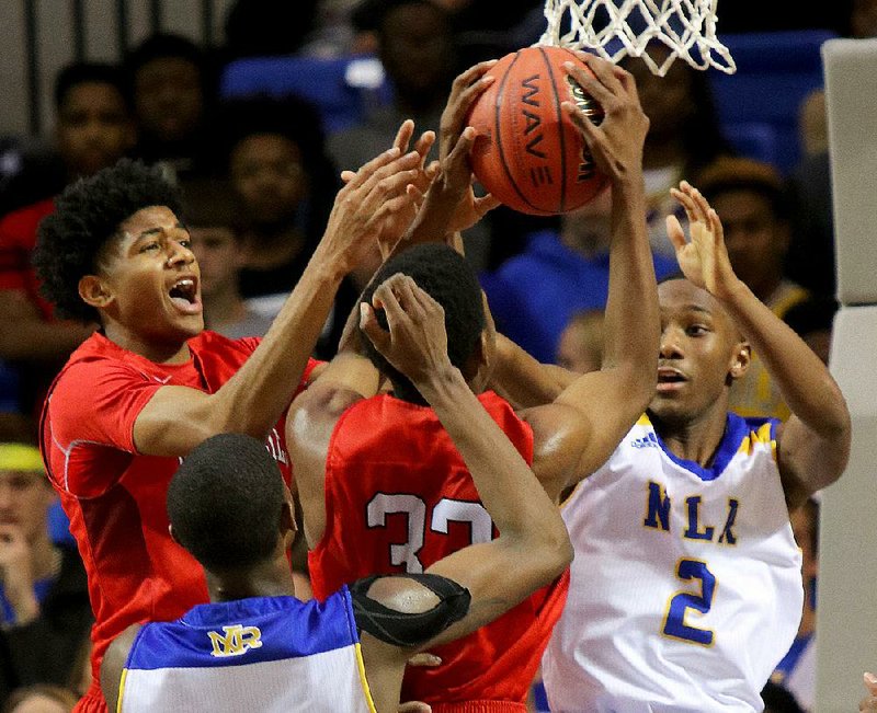 Kwashea Taylor (middle) and Isaiah Joe of Fort Smith Northside battle with North Little Rock’s Des Duckworth (2) for a rebound during Saturday’s Class 7A boys state championship game. 