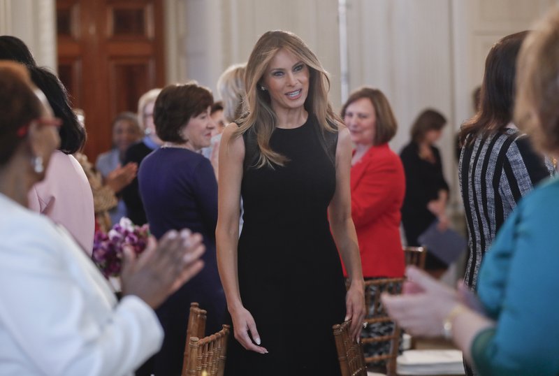 First lady Melania Trump arrives in the State Dining room of the White House in Washington, Wednesday, March 8, 2017, where she hosted a luncheon on International Women's Day. 