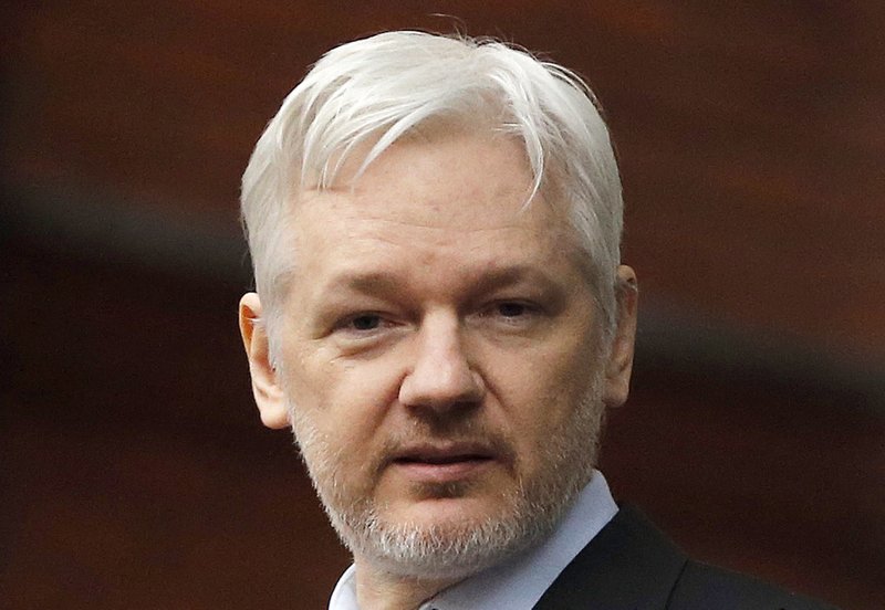 FILE - In this Feb. 5, 2016, file photo, WikiLeaks founder Julian Assange stands on the balcony of the Ecuadorean Embassy in London.
