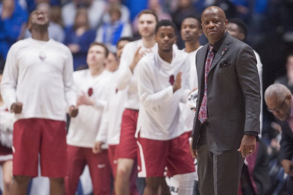 Arkansas coach Mike Anderson and the Razorbacks' bench watch during an SEC Tournament game against Kentucky on Sunday, March 12, 2017, in Nashville, Tenn. 