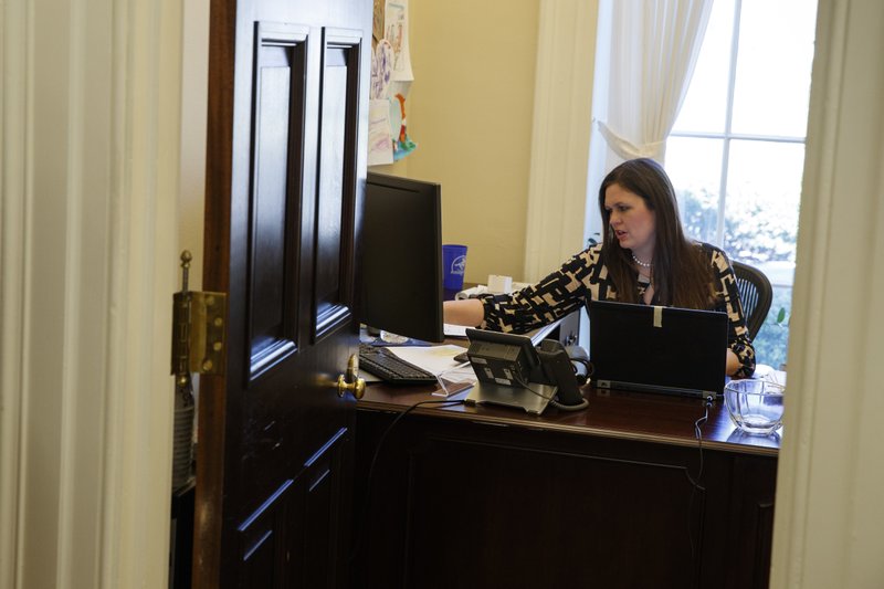 In this March 8, 2017, photo, White House deputy press secretary Sarah Huckabee Sanders works in her office at the White House in Washington.