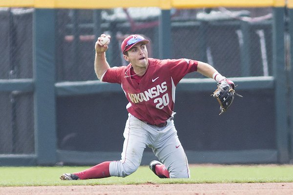 Arkansas second baseman Carson Shaddy makes a throw after a diving stop during a game against Rhode Island on Sunday, March 12, 2017, in Fayetteville. 