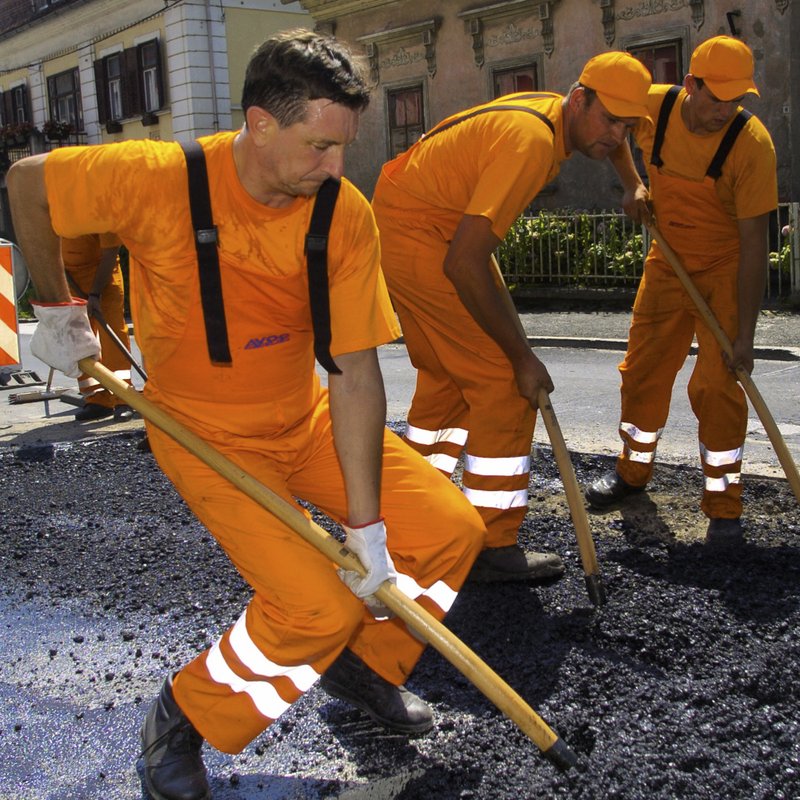 In this photo provided by the Office of the Slovenia's president and used on the president's Instagram, Slovenia's president Borut Pahor, left, takes part in roadworks near Dravograd, Slovenia, July 27, 2012. 