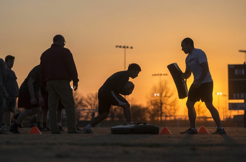 Kids 13 years old and up go through rugby drills Wednesday at the Tyson Sports Complex in Springdale. Youth rugby teams have been put together through the Springdale Parks and Recreation Department.