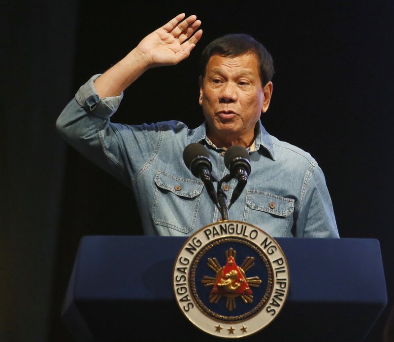 FILE - In this Wednesday, March 8, 2017, file photo, Philippine President Rodrigo Duterte gestures as he addresses thousands of the country's municipal councilors during its 10th National Congress in suburban Pasay city, south of Manila, Philippines. 