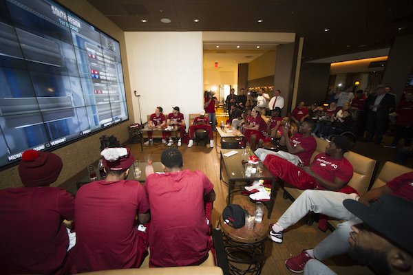 The Razorback basketball team cheers as their first NCAA Tournament site was chosen Sunday Mar. 12, 2017. The Hogs will play Seton Hall in Greenville S.C. on Friday.