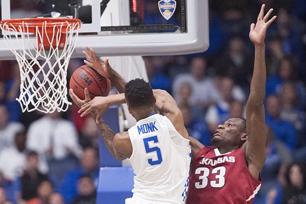 Kentucky's Malik Monk is fouled by Arkansas' Moses Kingsley during an SEC Tournament game Sunday, March 12, 2017, in Nashville, Tenn. 