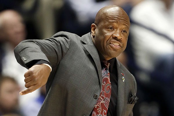 Arkansas head coach Mike Anderson directs his team in the first half of an NCAA college basketball game against Kentucky for the championship of the Southeastern Conference tournament Sunday, March 12, 2017, in Nashville, Tenn. (AP Photo/Wade Payne)

