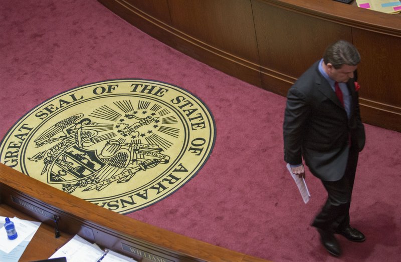 Sen. Jason Rapert, R-Conway, walks back to his seat in the Senate after his bill to prohibit the smoking of medical marijuana failed to pass for a second time Monday afternoon.
