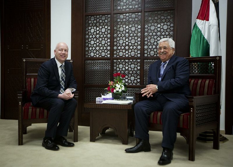U.S. envoy Jason Greenblatt (left) meets Tuesday with Palestinian President Mahmoud Abbas in the West Bank city of Ramallah a day after he met with Israeli Prime Minister Benjamin Netanyahu.