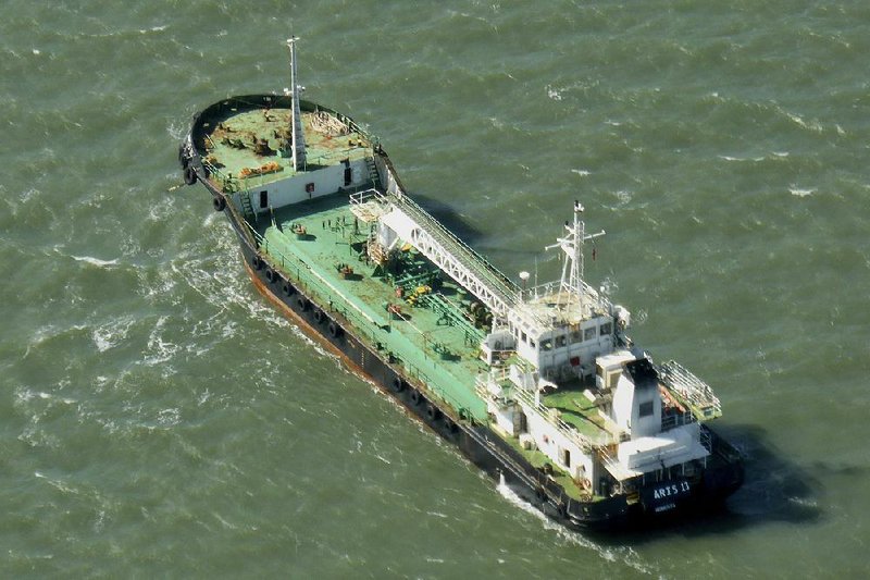 The Aris 13 oil tanker is seen from a helicopter in the harbor of Gladstone, Australia, in this 2014 file photo.