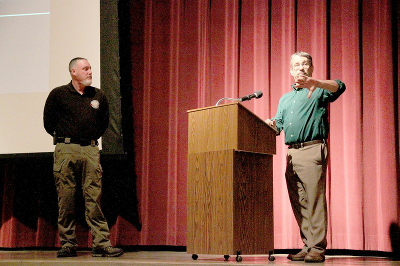LYNN KUTTER ENTERPRISE-LEADER John Luther with Washington County Emergency Management, left, and Steve Piltz, meterologist with National Weather Service in Tulsa, speak at the Tornado Town Hall meeting held last week at Lincoln Middle School.