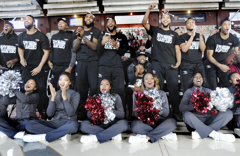 In this Sunday, March 12, 2017, file photo, the North Carolina Central basketball team and cheerleaders react, in Durham, N.C., to the announcement that the team will be playing UC Davis in Dayton, Ohio, in the NCAA men's college basketball tournament. 