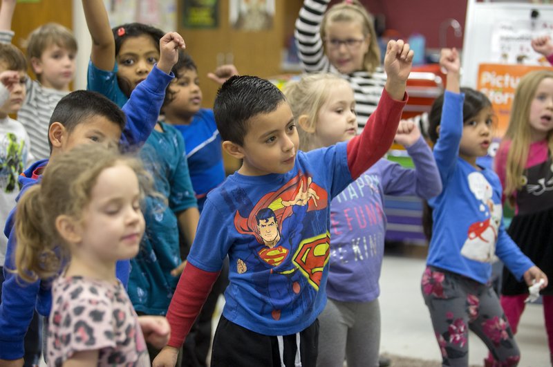 NWA Democrat-Gazette/JASON IVESTER
Alan Linares and classmates dance to a song in their kindergarten class on Friday, Jan. 20, 2017, at Reagan Elementary School in Rogers.