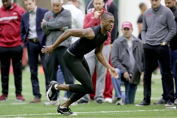Former Arkansas receiver Dominique Reed runs a drill during the Razorbacks' Pro Day on Wednesday, March 15, 2017, in Fayetteville. 