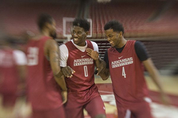 Arkansas guards Jaylen Barford (0) and Daryl Macon (4) interact during preseason media day on Wednesday, Oct. 5, 2016, in Fayetteville. 