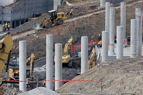 Work continues Monday, March 13, 2017, on the north end zone of Donald W. Reynolds Razorback Stadium in Fayetteville. The renovation is part of a $160 million project that will fully enclose the 78-year-old stadium. The stadium will grow from a capacity of 72,000 to about 77,000 in September 2018. The project includes new premium seating, including Founders Club Suites on the east side of the stadium, outdoor loge boxes - a cluster of four to eight seats separated from others by a partition - and club seating. The new seating areas will connect the concourse to the east and west walkways. Work continues Monday, March 13, 2017, on the north end zone of Donald W. Reynolds Razorback Stadium in Fayetteville. The renovation is part of a $160 million project that will fully enclose the 78-year-old stadium. The stadium will grow from a capacity of 72,000 to about 77,000 in September 2018. The project includes new premium seating, including Founders Club Suites on the east side of the stadium, outdoor loge boxes - a cluster of four to eight seats separated from others by a partition - and club seating. The new seating areas will connect the concourse to the east and west walkways.
