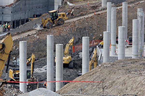 Work continues Monday, March 13, 2017, on the north end zone of Donald W. Reynolds Razorback Stadium in Fayetteville. The renovation is part of a $160 million project that will fully enclose the 78-year-old stadium. The stadium will grow from a capacity of 72,000 to about 77,000 in September 2018. The project includes new premium seating, including Founders Club Suites on the east side of the stadium, outdoor loge boxes - a cluster of four to eight seats separated from others by a partition - and club seating. The new seating areas will connect the concourse to the east and west walkways.