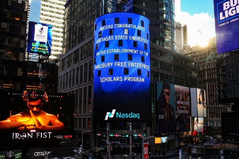 An electronic message Wednesday on the Nasdaq building in New York City’s Times Square congratulates Arkansas State University on its Bradbury Free Enterprise Scholars Program. 