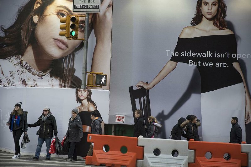 Shoppers visit stores in New York’s Soho neighborhood earlier this week. Clothing and sporting-goods stores were among the retailers reporting lower sales in February. 