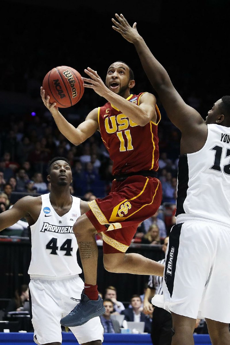 Southern California guard Jordan McLaughlin had 18 points, 10 rebounds and 4 assists as the Trojans battled back from a 17-point deficit in the second half to beat Providence 75-71 in the final NCAA Tournament First Four game Wednesday night in Dayton, Ohio.