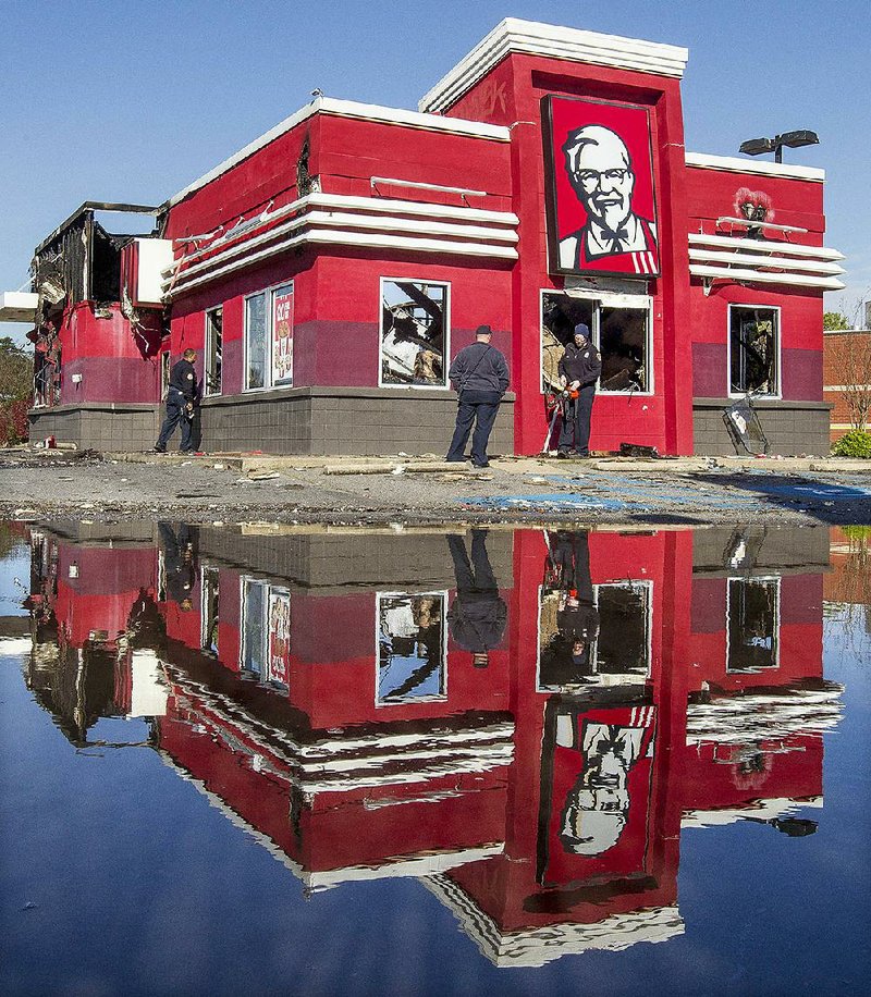 Arkansas Democrat-Gazette/BENJAMIN KRAIN --3/15/17--
Little Rock firefighters revisit a KFC at 100 Markham Park Drive Wednesday checking for any rekindling after battling a large fire at the restaurant hours earlier around 3 am Wednesday morning. The source of the fire is still being investigated.
MORE PHOTOS ONLINE