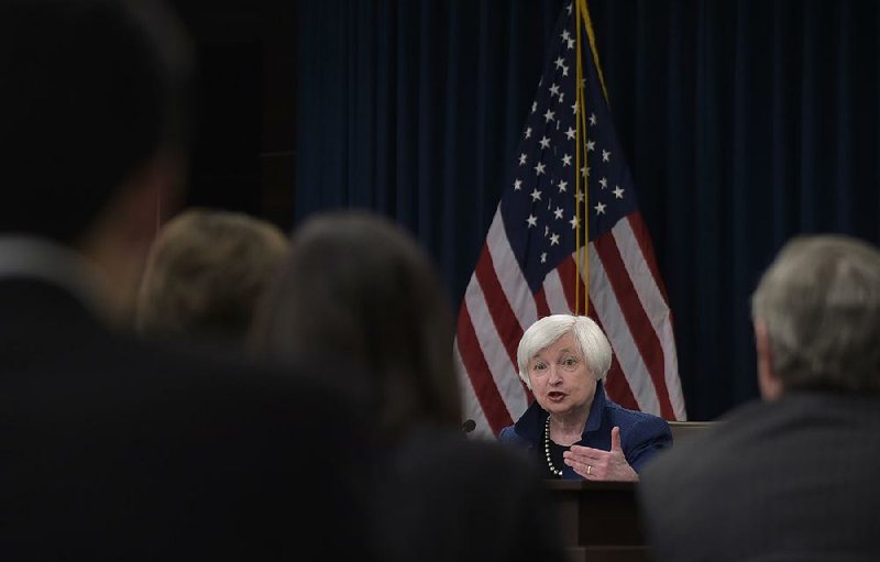 Federal Reserve Chairman Janet Yellen said Wednesday in Washington that the decision to raise the benchmark interest rate “does not represent a reassessment” but reflects continued economic progress.