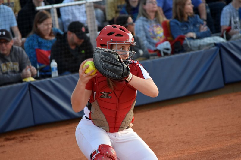 NWA Democrat-Gazette/MIKE CAPSHAW Farmington sophomore catcher Alyssa Reed loads up to throw down to second base during the Lady Cardinals' game at Bentonville West on March 9, 2017.