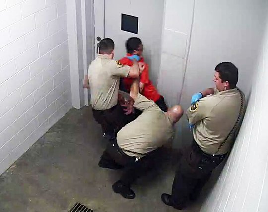 Submitted photo JAIL VIDEO: A video capture from the security camera at the Garland County Detention Center shows a confrontation between an arrested suspect, William Moser, and detention center employees.