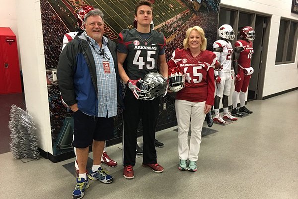 Arkansas tight end commit Luke Ford, center, with parents Tim and Lisa. 