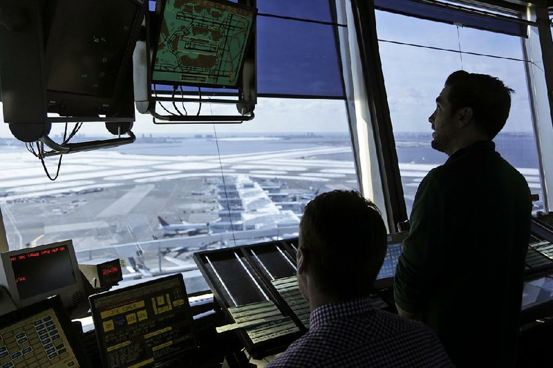 Air traffic controllers work in the tower at John F. Kennedy International Airport in New York on Thursday. President Donald Trump is calling for privatizing the nation’s air traffic control operations in his budget proposal, a top priority of the airline industry. 