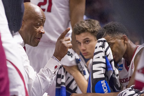 Arkansas coach Mike Anderson talks to players during the Razorbacks' 77-71 NCAA Tournament win over Seton Hall on Friday, March 17, 2017, in Greenville, S.C.