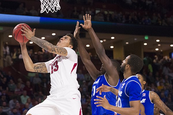 Arkansas forward Dustin Thomas goes up for a shot during the Razorbacks' 77-71 NCAA Tournament win over Seton Hall on Friday, March 17, 2017, in Greenville, S.C.