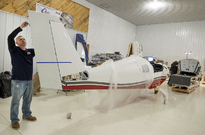 Andy Enos of Midwest Sky Sports works last month on a Sling 2 aircraft at Tuscola Area Airport near Caro, Mich., where the company assembles aircraft from kits. Manufacturing output in February was led by fabricated metals, machinery, and plastics, paper and rubber production.
