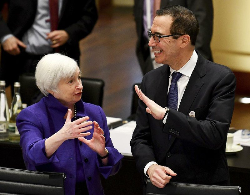 Federal Reserve Chairman Janet Yellen talks Friday with U.S. Treasury Secretary Steven Mnuchin during the G20 finance ministers meeting in Baden-Baden, Germany.