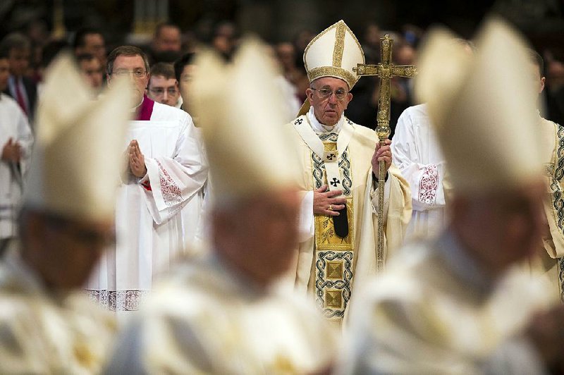Pope Francis, shown leaving after celebrating Mass in St. Peter’s Basilica at the Vatican, has indicated an openness to ordaining married men to serve as priests in places facing a dire priest shortage. 
