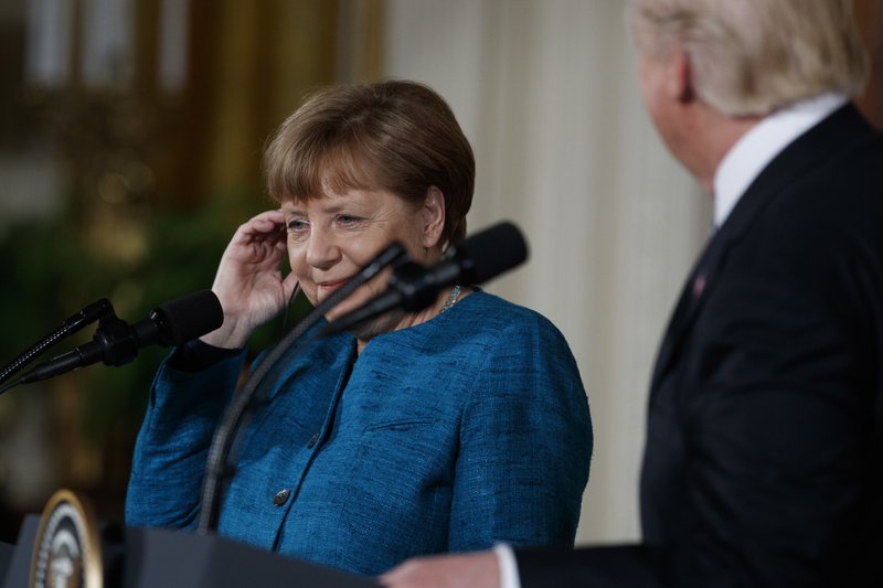 German Chancellor Angela Merkel listens as President Donald Trump speaks during a news conference in the East Room of the White House, Friday, March 17, 2017, in Washington. (AP Photo/Evan Vucci)