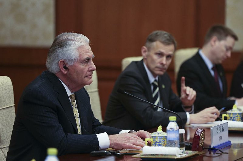 U.S. Secretary of State Rex Tillerson (left) attends a meeting Saturday at Diaoyutai State Guesthouse in Beijing.