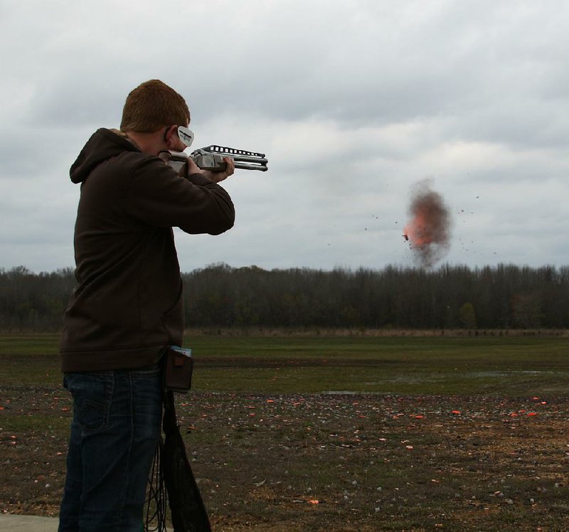 Jacksonville’s Ryan Bowen dusts a clay target Friday at the Arkansas Game and Fish Foundation Shooting Sports Complex in Jacksonville.