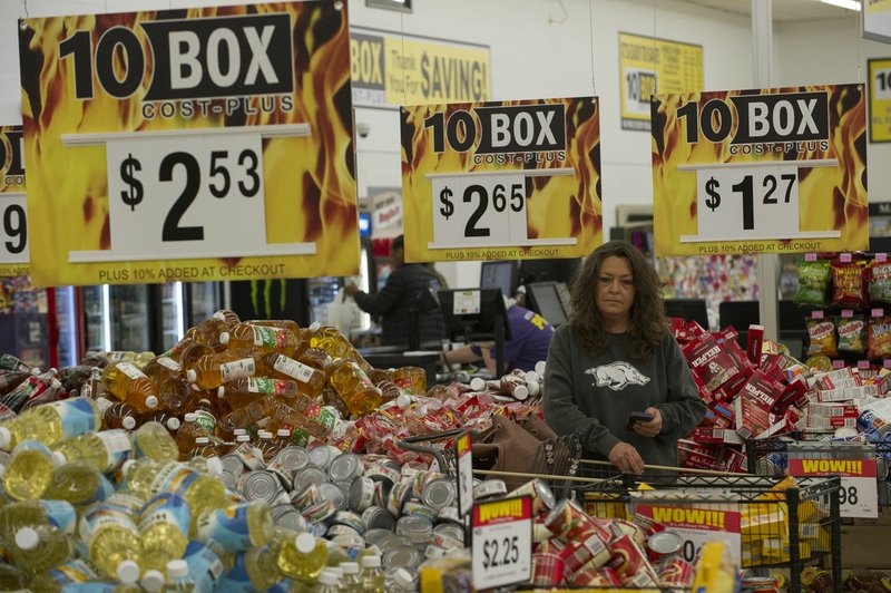 NWA Democrat-Gazette/J.T. WAMPLER Donna Cunningham of Elkins shops at 10 Box Cost Plus in Springdale on Feb. 2. Harps closed its Price Cutter grocery store in Springdale and replaced it with the company&#8217;s third 10 Box Cost Plus store. Sales tax collections were up in Washington and Benton counties in January and February.