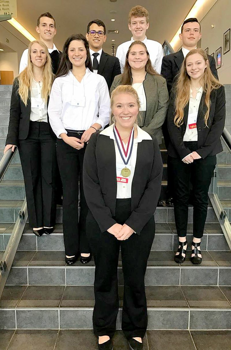 Photo submitted Nine Health Occupations Student Association students from Siloam Springs High School attended the Arkansas State HOSA Conference in Hot Springs on March 8-10. Pictured are (front row) Cymber Henderson; (second row, from left) Gracie Patterson, Hadlee Hollenback, Christine Honn, Madison Brasel, (back row, from left) Christian Torres, Riky Vasquez, Mason Cooper and A.J. Serrano.