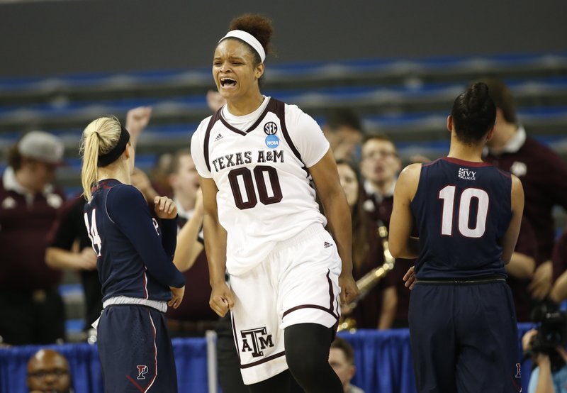 Texas A&M center Khaalia Hillsman celebrates after being fouled and still making her shot against Penn during the second half of a first-round game in the NCAA women's college basketball tournament, Saturday, March 18, 2017, in Los Angeles. 
