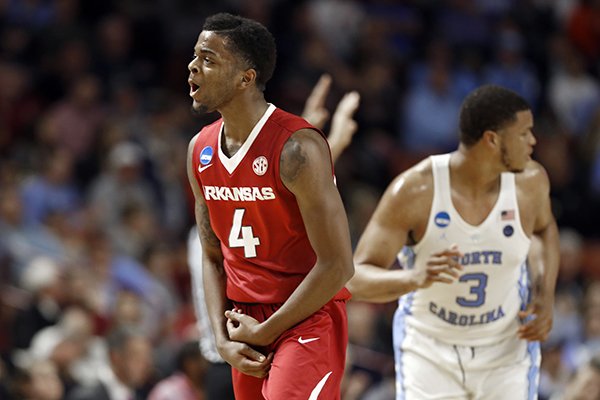 Arkansas' Daryl Macon (4) reacts after making a three-point basket against North Carolina during the first half in a second-round game of the NCAA men's college basketball tournament in Greenville, S.C., Sunday, March 19, 2017. (AP Photo/Chuck Burton)

