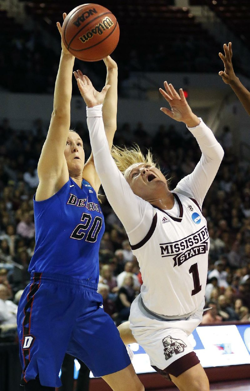 Mississippi State guard Blair Schaefer (right) is fouled by DePaul’s Kelly Campbell as she drives for a layup in the first half of the Bulldogs 92-71 victory in Starkville, Miss.