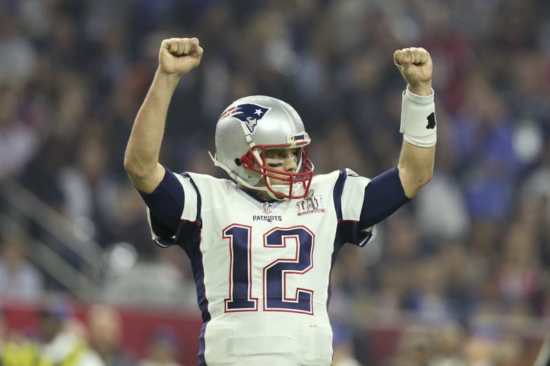 FILE - In this Feb. 5, 2017, file photo, New England Patriots quarterback Tom Brady celebrates a touchdown against the Atlanta Falcons during Super Bowl 51 in Houston. Tom Brady's missing jersey from the Super Bowl has been found in the possession of a member of the international media. The NFL said in a statement Monday, March 20, 2017 that his jersey was found through the "cooperation of the NFL and New England Patriots' security teams, the FBI and other law enforcement authorities." (AP Photo/Gregory Payan, File)
