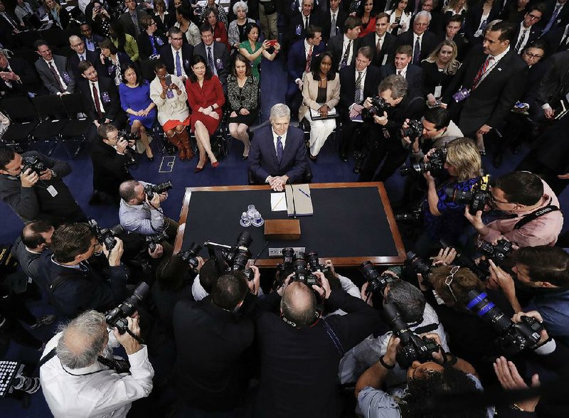 Supreme Court nominee Neil Gorsuch arrives Monday on Capitol Hill for his confi rmation hearing before the Senate Judiciary Committee.