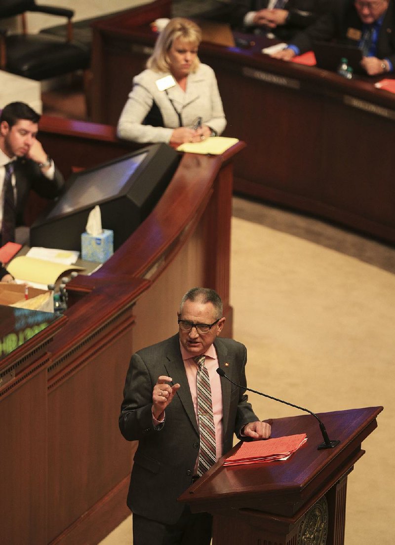 Rep. Douglas House speaks Monday afternoon against House Bill 1392, which would ban the use of medical marijuana in food and drink. Also on the House floor was Rep. Robin Lundstrum (top), who sponsored the bill.