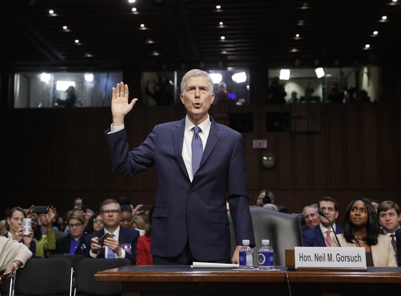 Supreme Court Justice nominee Neil Gorsuch is sworn-in on Capitol Hill in Washington, Monday, March 20, 2017, during his confirmation hearing before the Senate Judiciary Committee. (AP Photo/Pablo Martinez Monsivais)