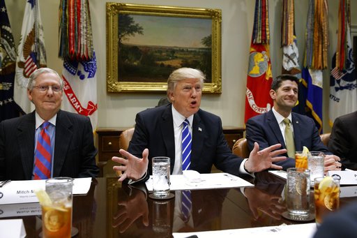 FILE - This Wednesday, March 1, 2017, file photo shows President Donald Trump, flanked by Senate Majority Leader Mitch McConnell of Ky., left, and House Speaker Paul Ryan of Wis., right as he speaks during a meeting with House and Senate leadership in the Roosevelt Room of the White House in Washington. The president is deploying an outside and inside strategy to fulfill his campaign promise to repeal and replace &#x201c;Obamacare,&#x201d; seeking support beyond Washington before making an in-person pitch on Capitol Hill. (AP Photo/Evan Vucci, File)