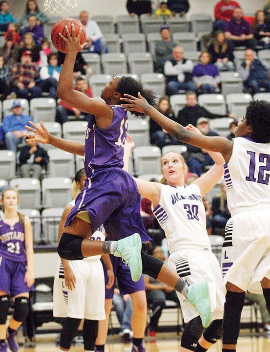 Christyn Williams, a junior at Central Arkansas Christian, drives to the basket during action against Lonoke in January. For the second consecutive season, Williams is the Gatorade Arkansas Girls Basketball Player of the Year. 